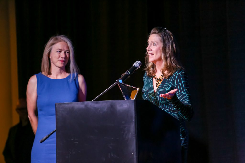 Diane Diamantis of Dollars 4 TICS accepts the Rising Star awards from .ORG Board Chair Lise Fuhr