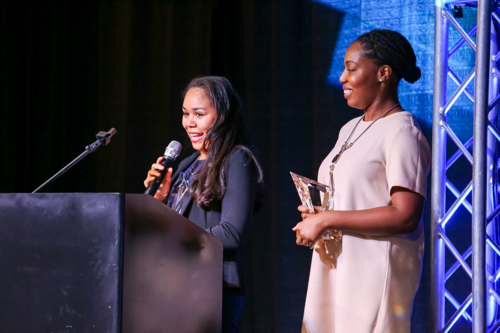 Ava Miles and Stephanie Davis of Teach For America accet the award for Outstanding Online Fundraising Campaign